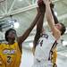 Dexter junior Brandon Bednarz and Ypsilanti senior Justin Bernard reach for a rebound in the first half on Friday, Feb. 15. Daniel Brenner I AnnArbor.com